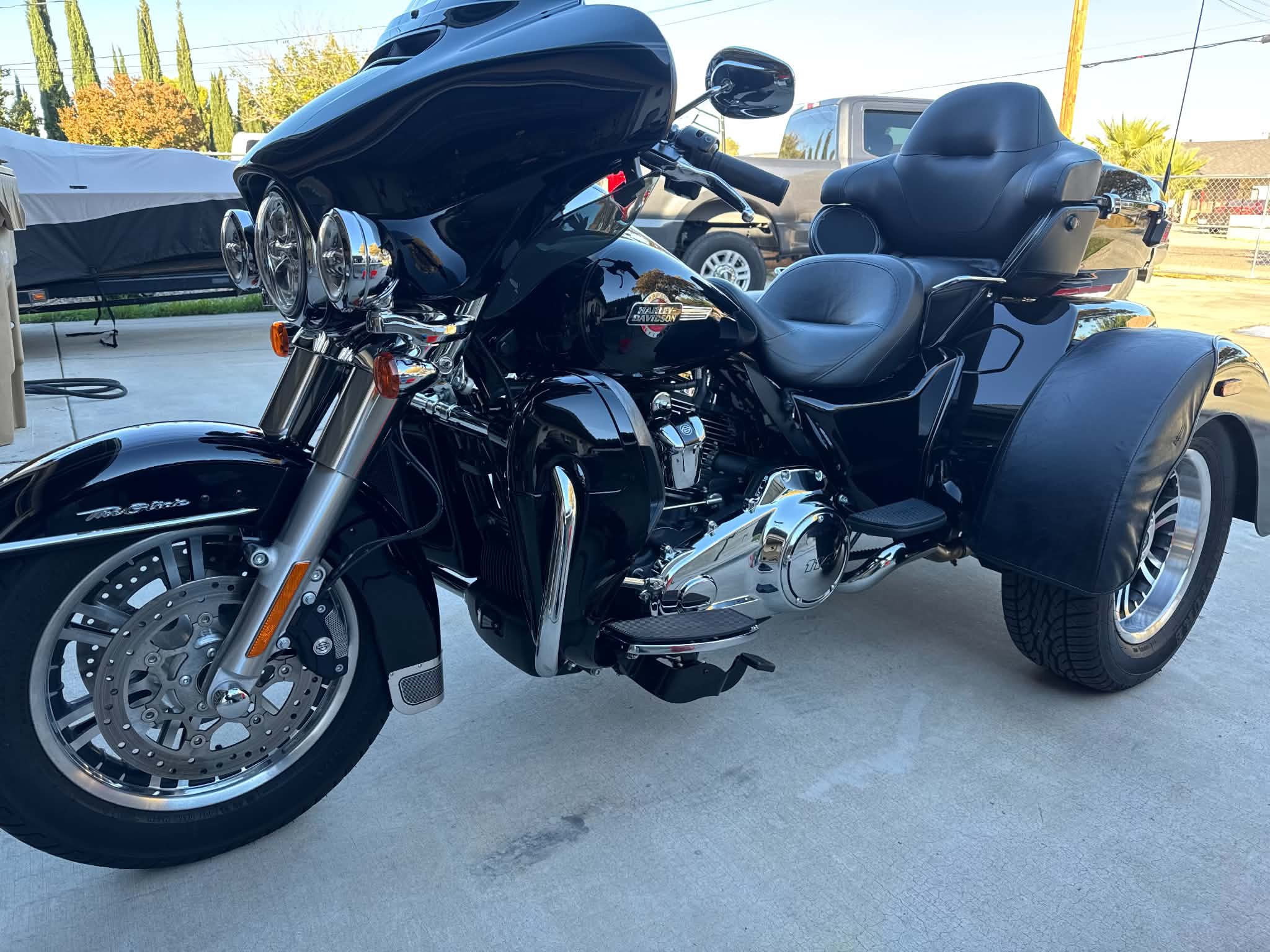 Black Harley-Davidson trike with polished chrome after a full detail