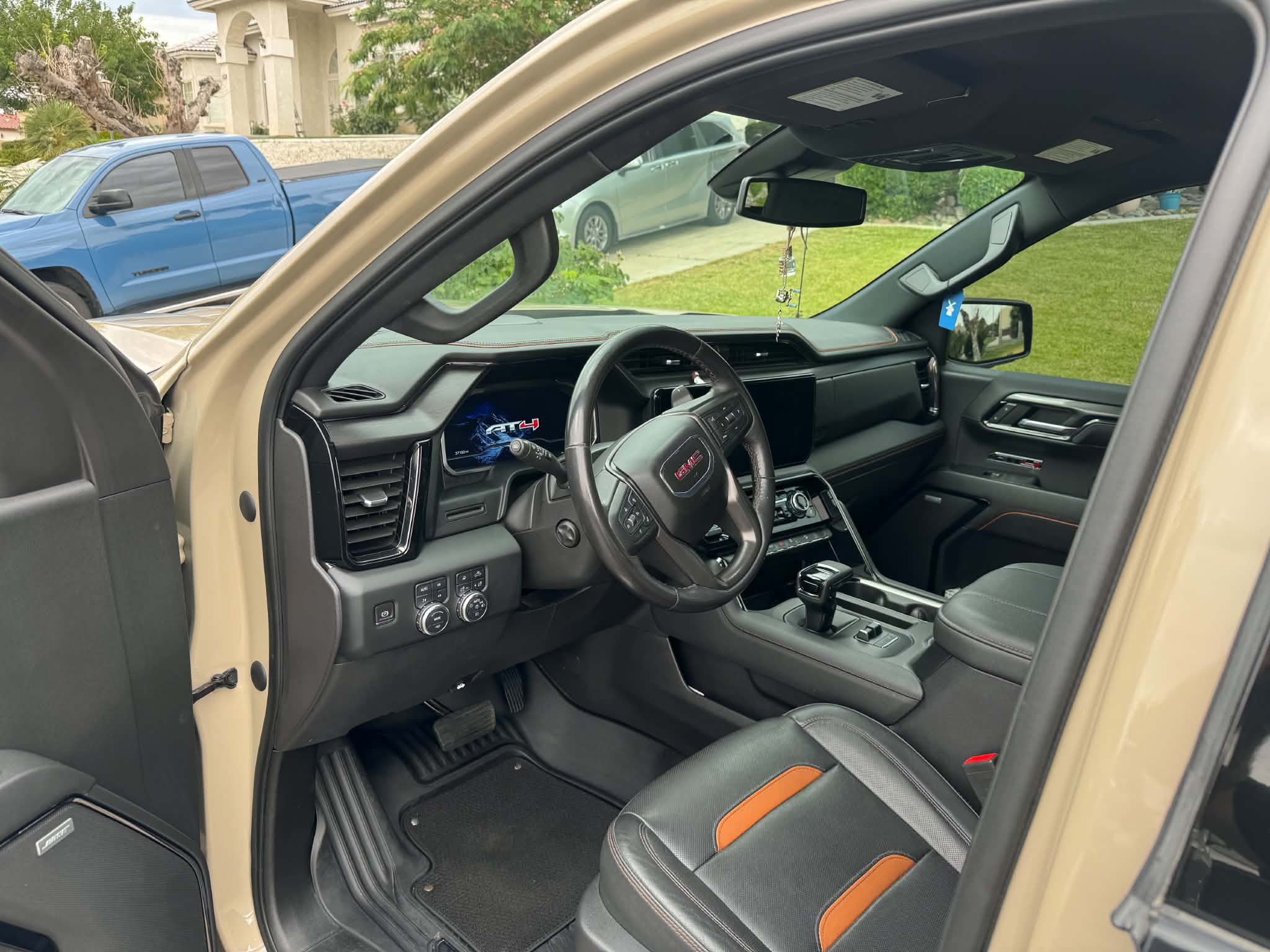 GMC Sierra AT4 interior after a full interior detail — spotless dash, wheel and leather